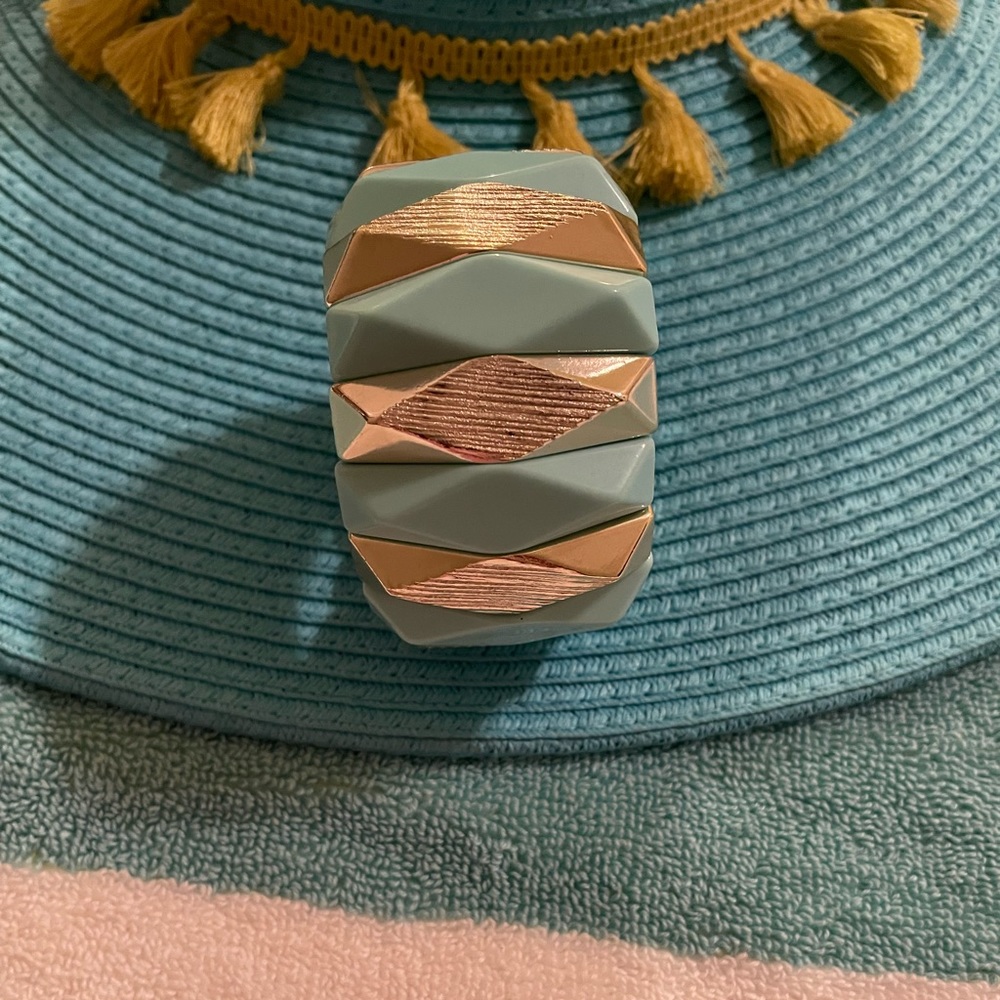 Blue and silver bracelet. Bracelet has elastic fit and wears really good.